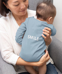 long-sleeve-onesie-keep-calm-and-smile-backside-baby-blue