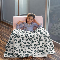 minky-blanket-snow-leopard-on-girl
